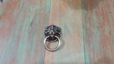 Lion head brass handle Item code P.056 size wide 45 mm long 75 mm. Lion head brass handle Item code P.056 size wide 45 mm long 75 mm.